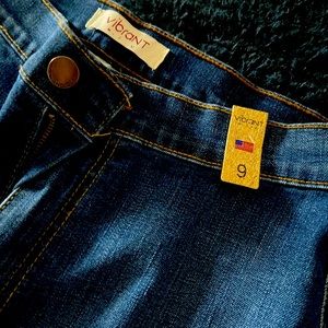 Dark wash bell bottom boot jeans.